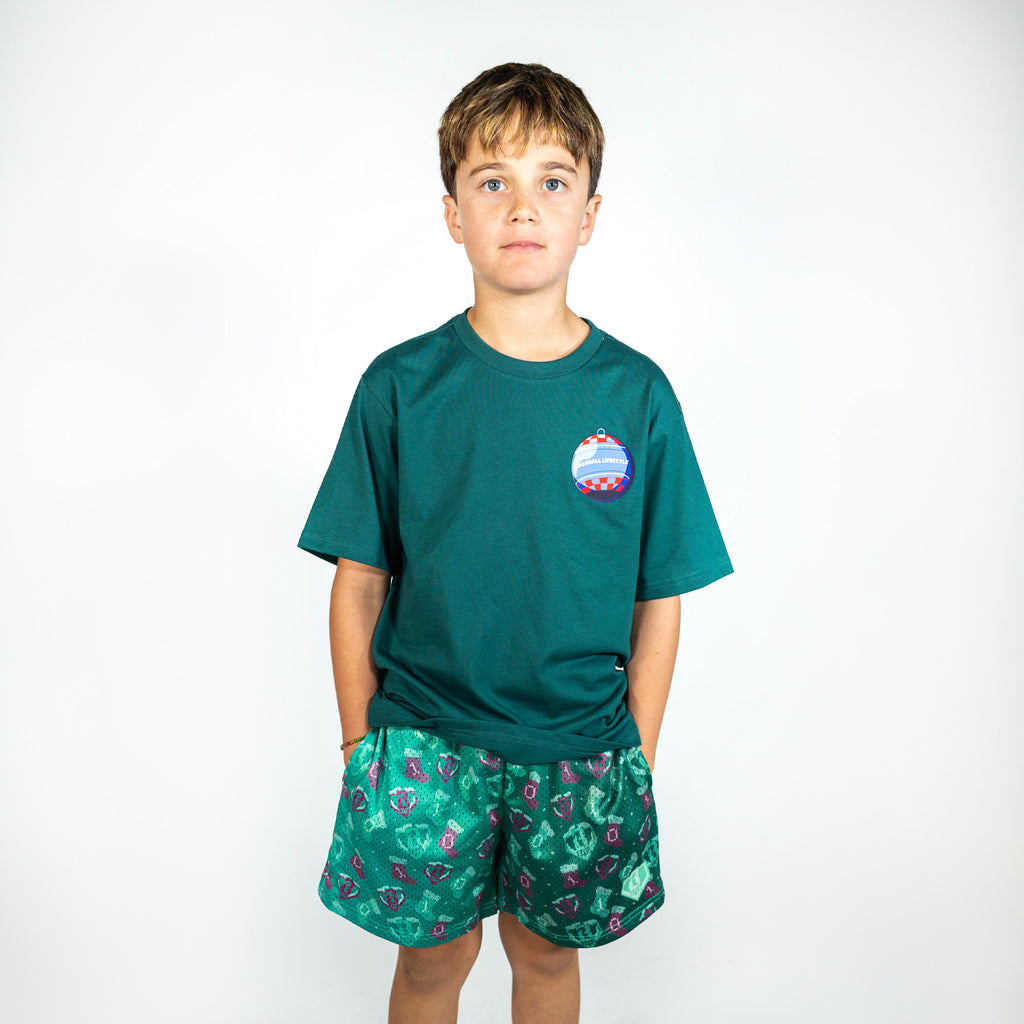 Youth model wearing green Stitched For The SZN youth shorts
