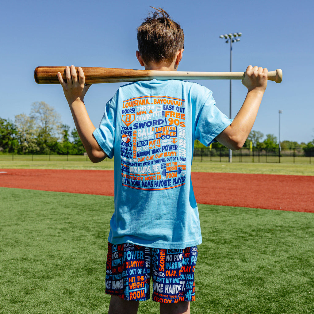 Youth model wearing blue youth graphic tee with "Trash Talk Youth" design