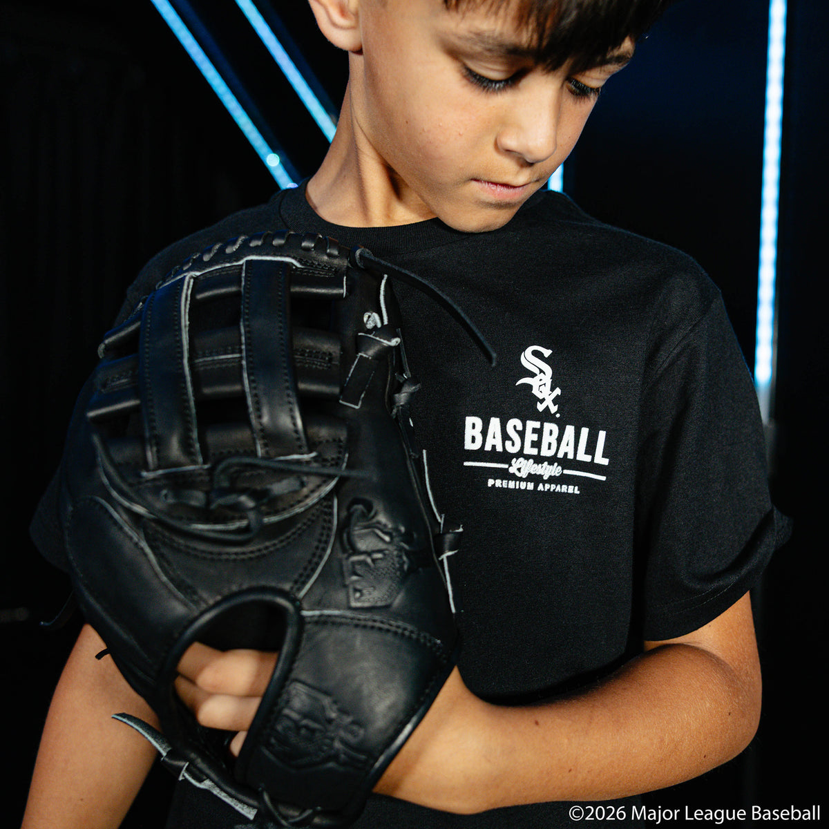 Youth model wearing black youth graphic tee with "Chicago White Sox Ice Cream" design