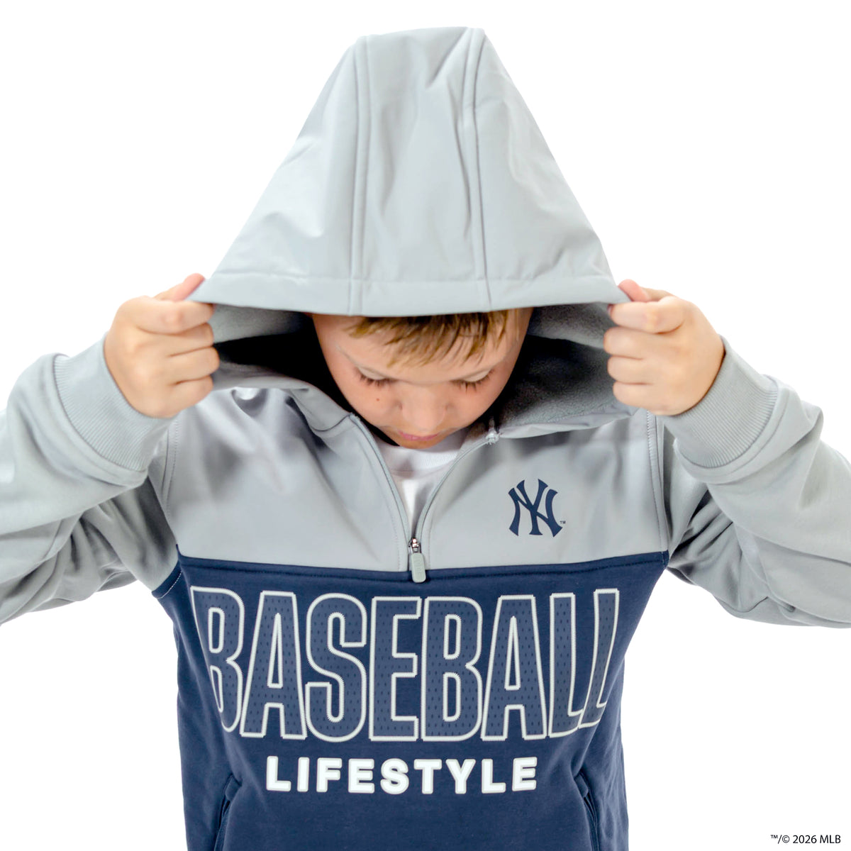 Youth model wearing navy New York Yankees Color Block youth quarter zip