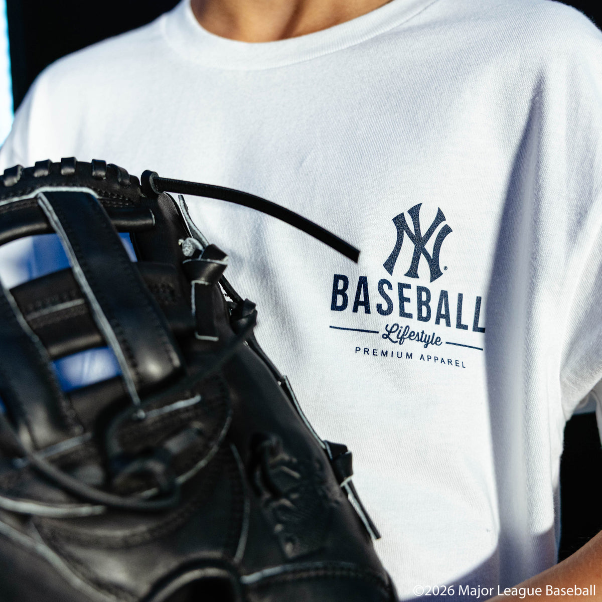 Youth model wearing white youth graphic tee with "New York Yankees Ice Cream" design