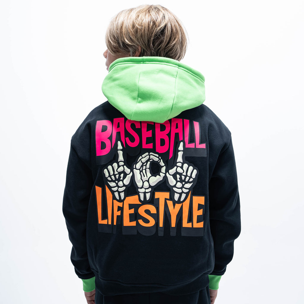 Youth model wearing black youth hoodie with "101 Skeleton" design