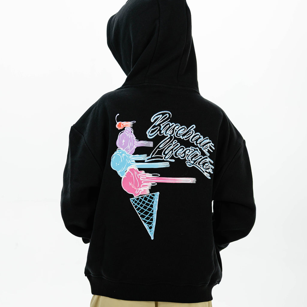 Youth model wearing black youth hoodie with "Fastball Scoops" design