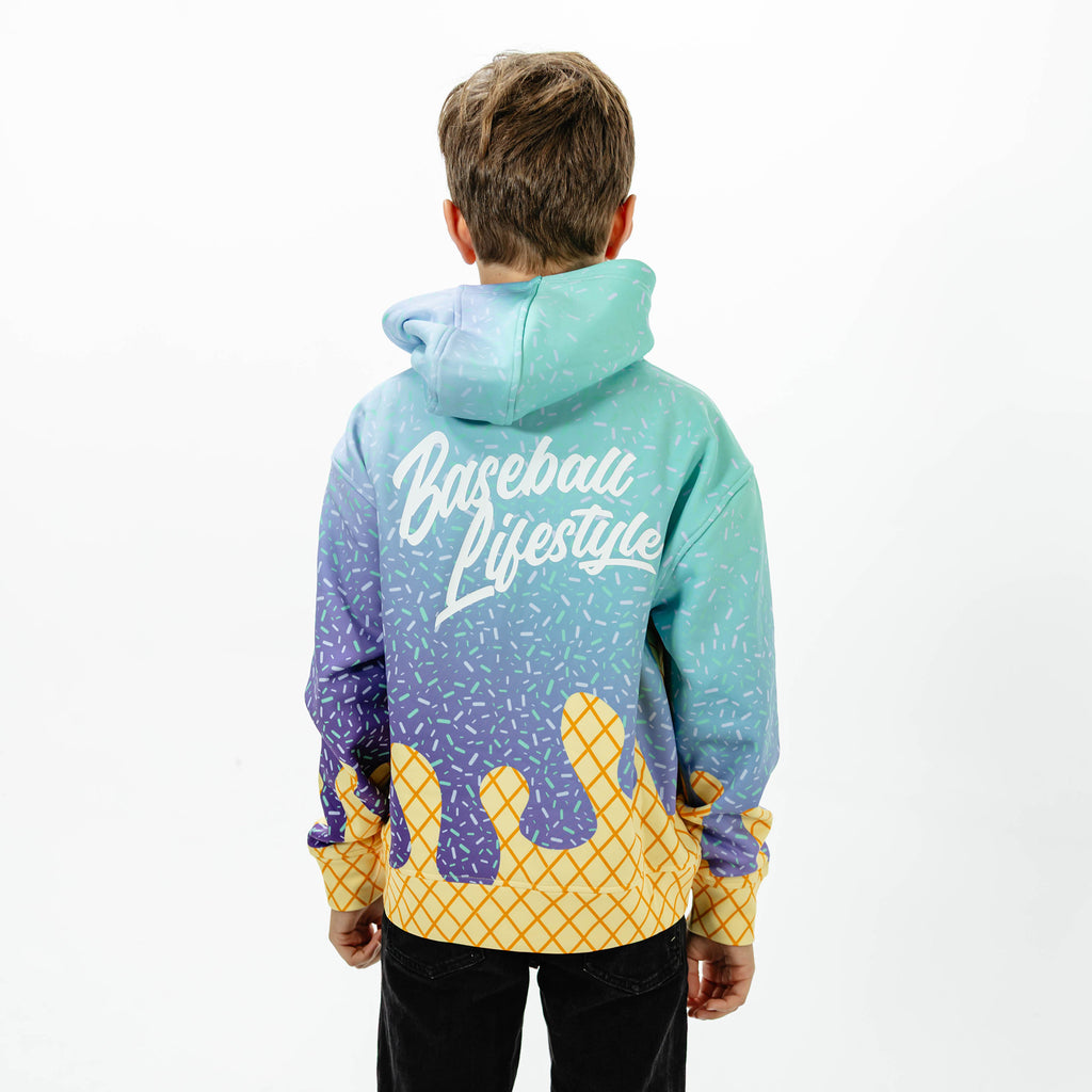 Youth model wearing multi-color Ice Cream Galaxy Grape youth hoodie with "Ice Cream" design