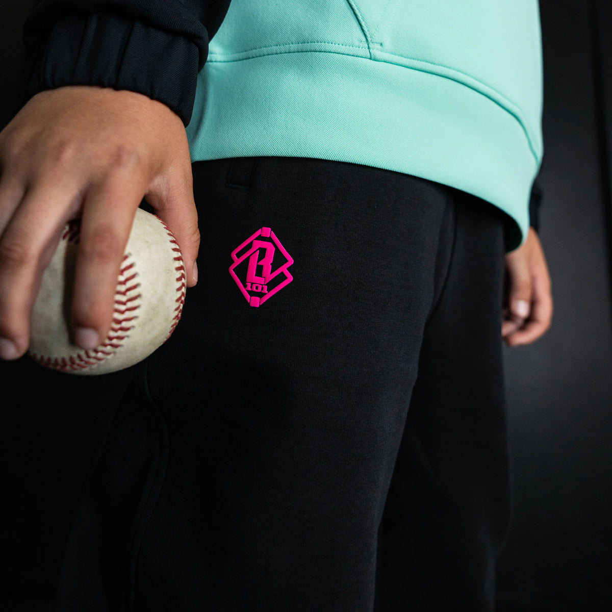 Youth model wearing black relaxed fit joggers with "King Of JUCO Diamond" design