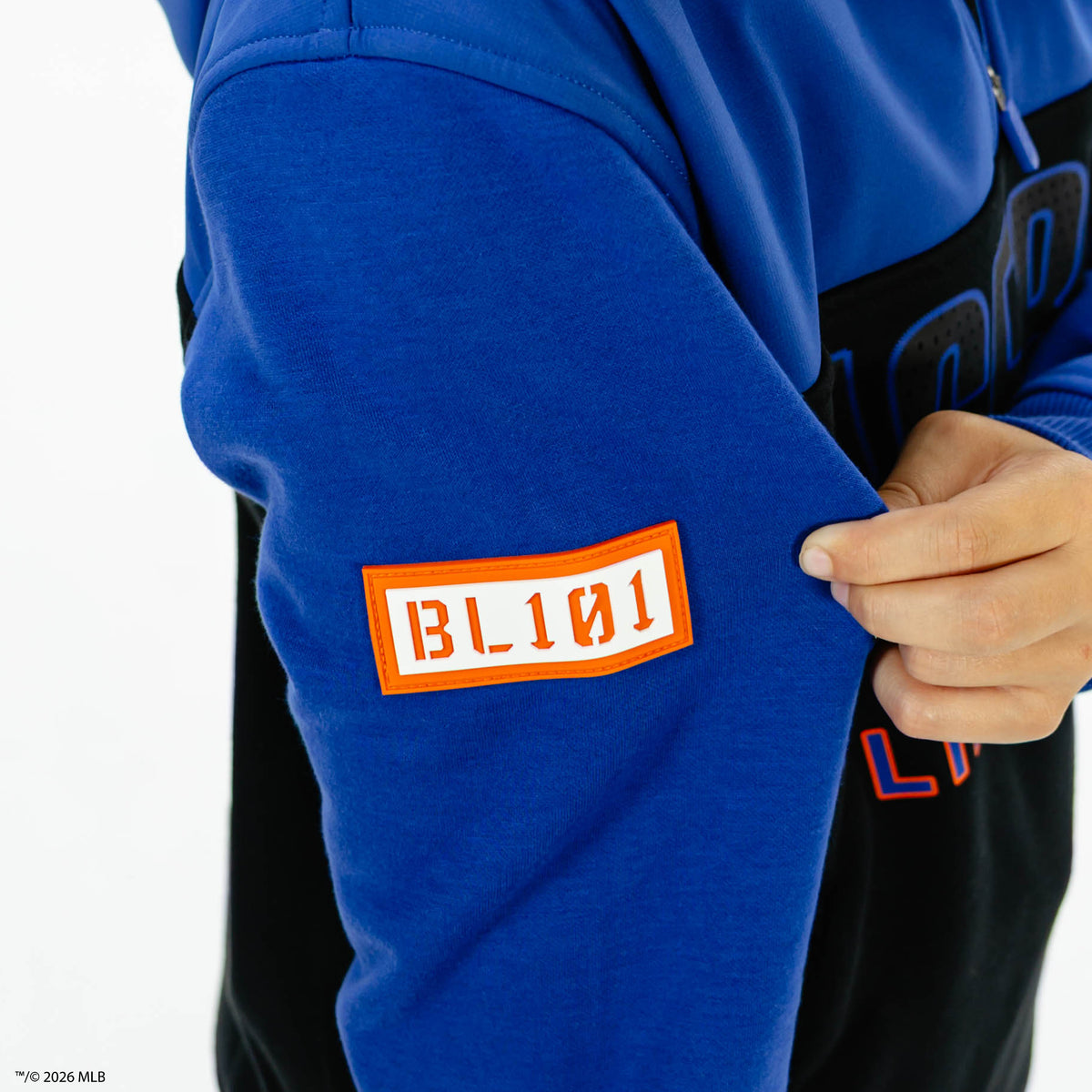Youth model wearing blue New York Mets Color Block youth quarter zip