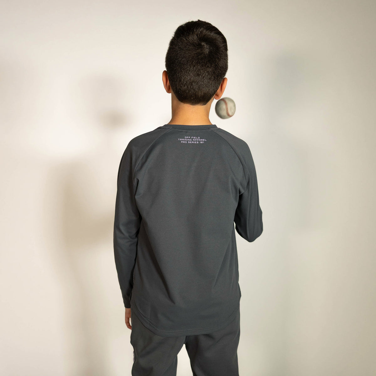 Youth model wearing gray and lilac Diamond Tech youth long sleeve