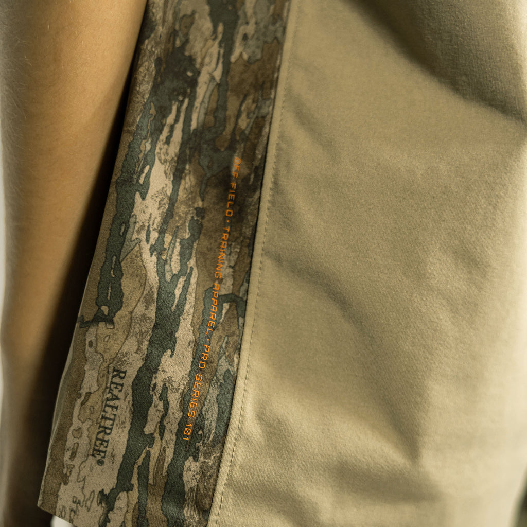 Youth model wearing brown Realtree Legacy Diamond Tech Camo youth vented tee
