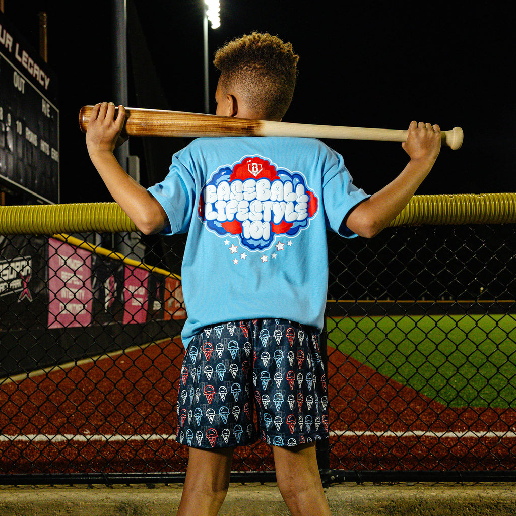 Youth model wearing red, white & blue Scoops Ice Cream youth shorts