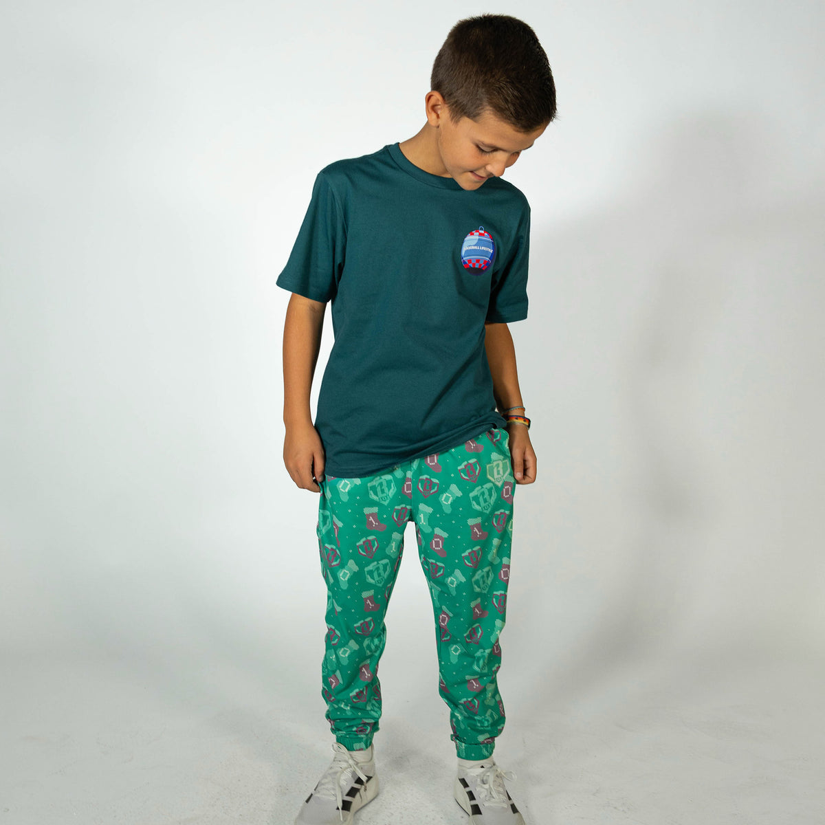 Youth model wearing green Stitched For The SZN youth pajama pants