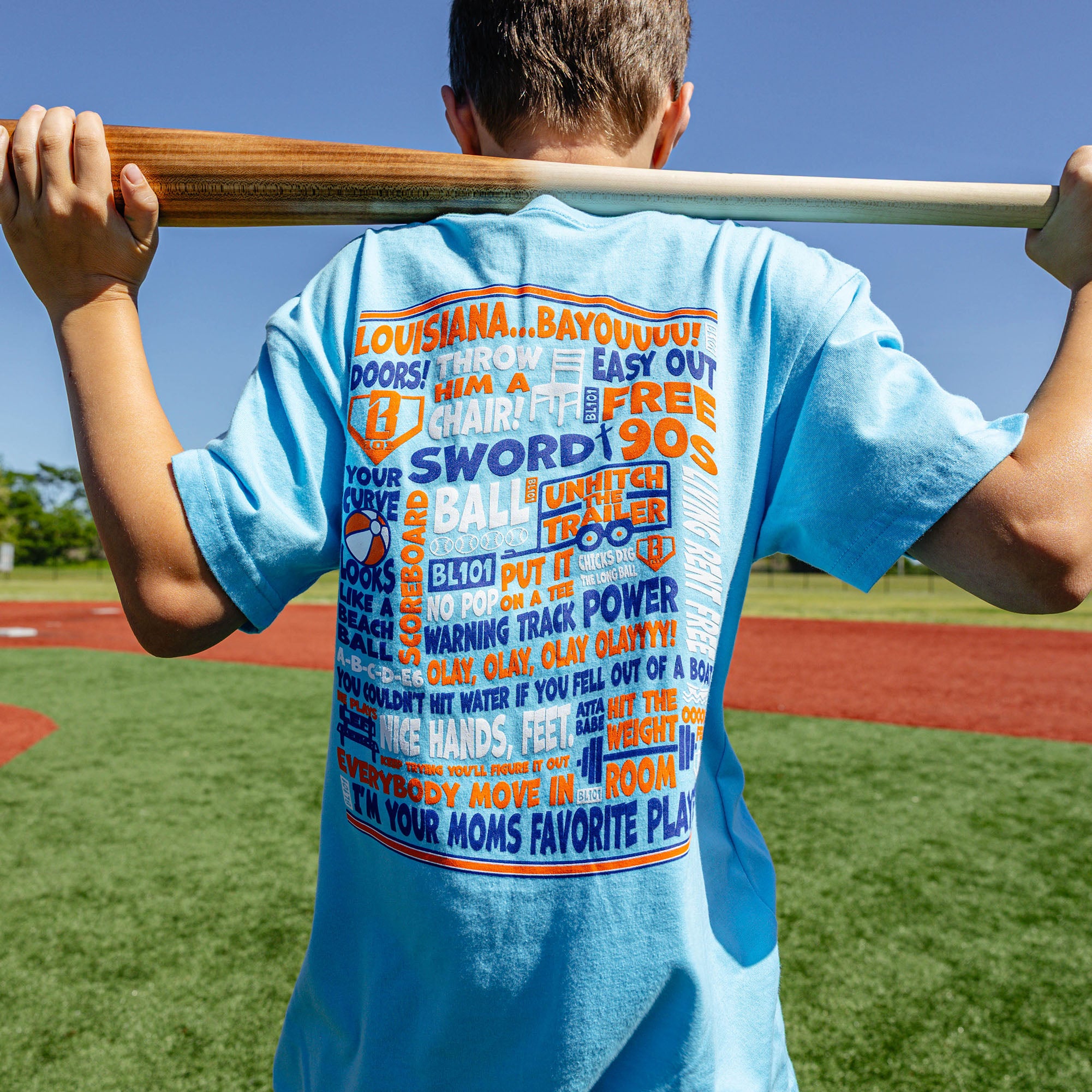 Youth model wearing blue youth graphic tee with "Trash Talk Youth" design