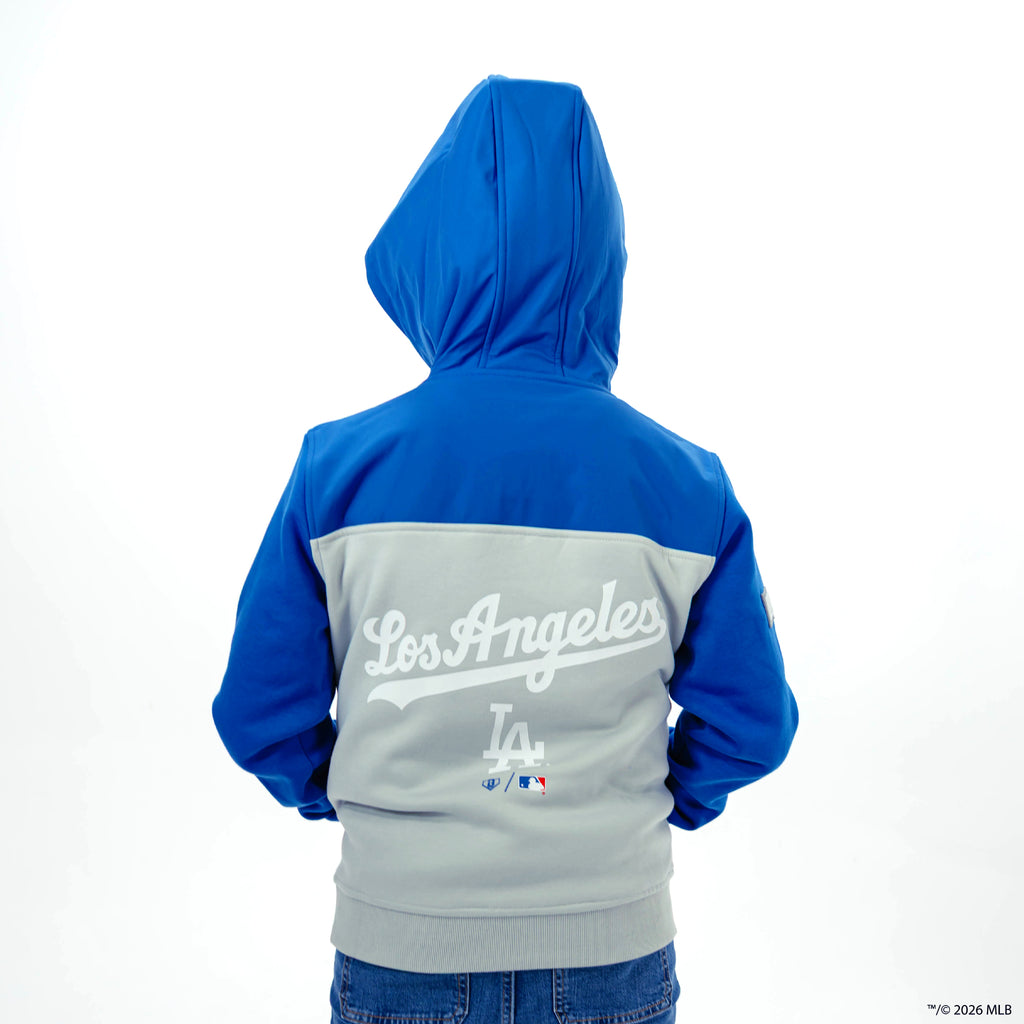 Youth model wearing blue Los Angeles Dodgers Color Block youth quarter zip