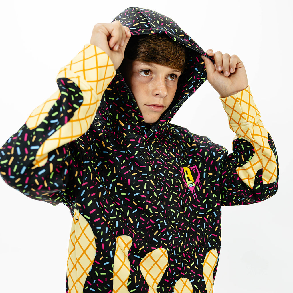 Youth model wearing black Ice Cream Midnight Sundae youth hoodie with "Ice Cream" design