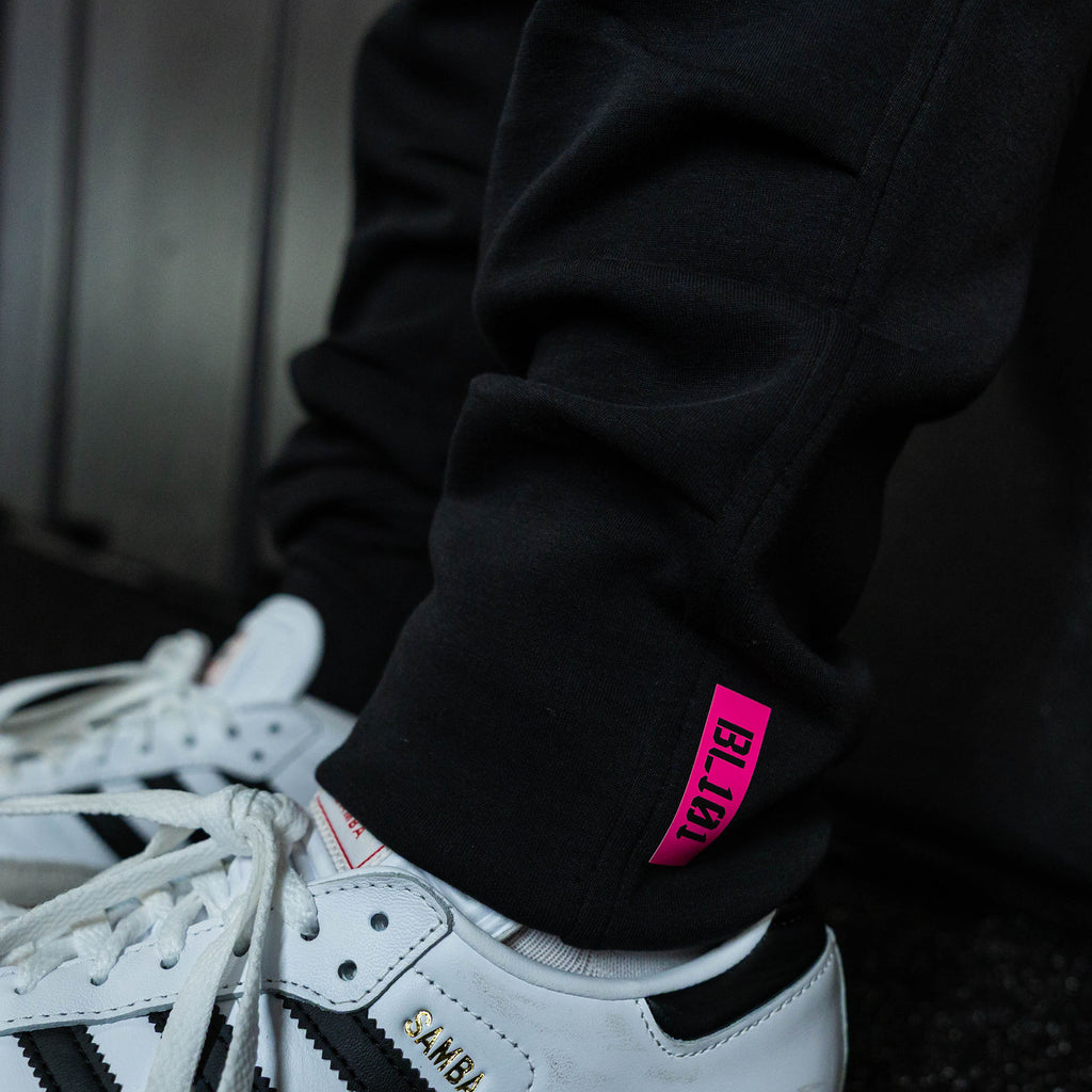 Youth model wearing black relaxed fit joggers with "King Of JUCO Diamond" design