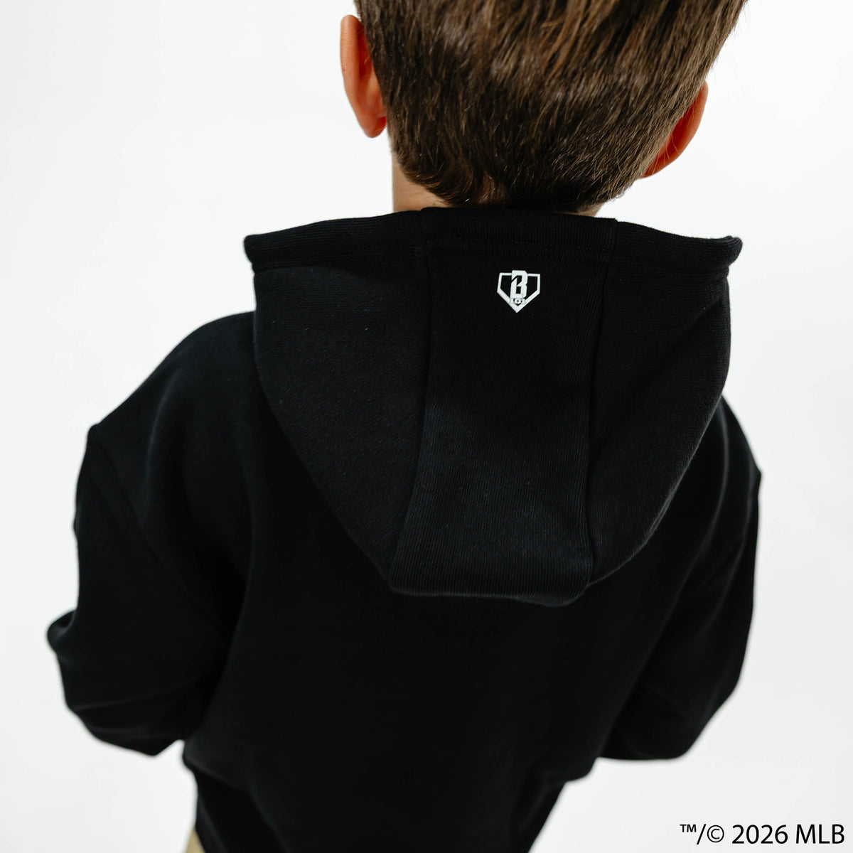 Youth model wearing black BL101 x MLB Established League youth hoodie