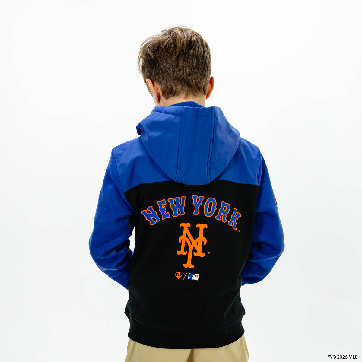 Youth model wearing blue New York Mets Color Block youth quarter zip