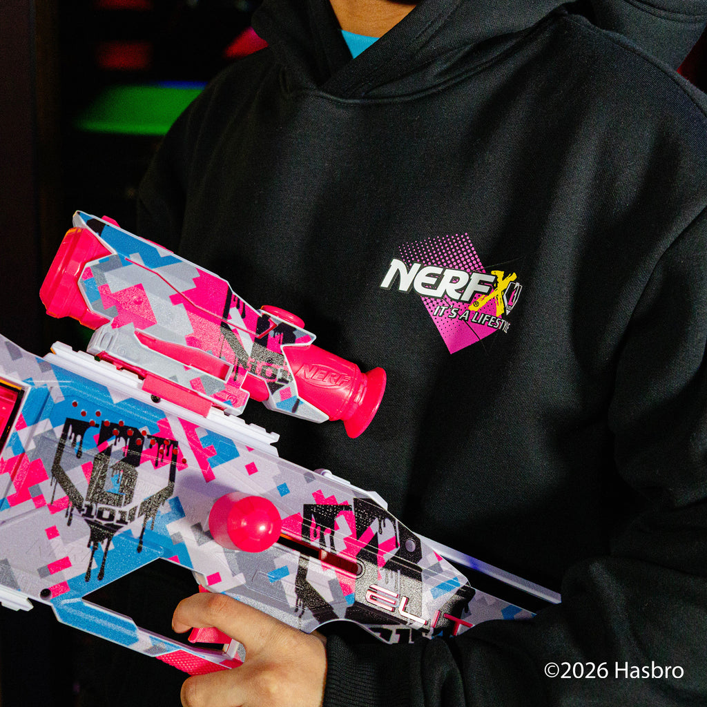 Person wearing a black hoodie with a Nerf X BL101 logo, holding two colorful nerf guns.