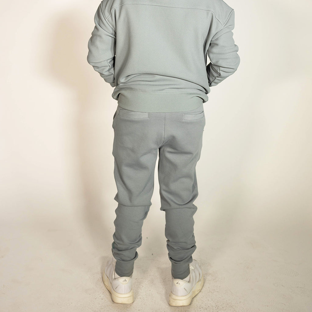 Youth model wearing gray Realtree Aspect Diamond Relaxed Fit Camo youth joggers