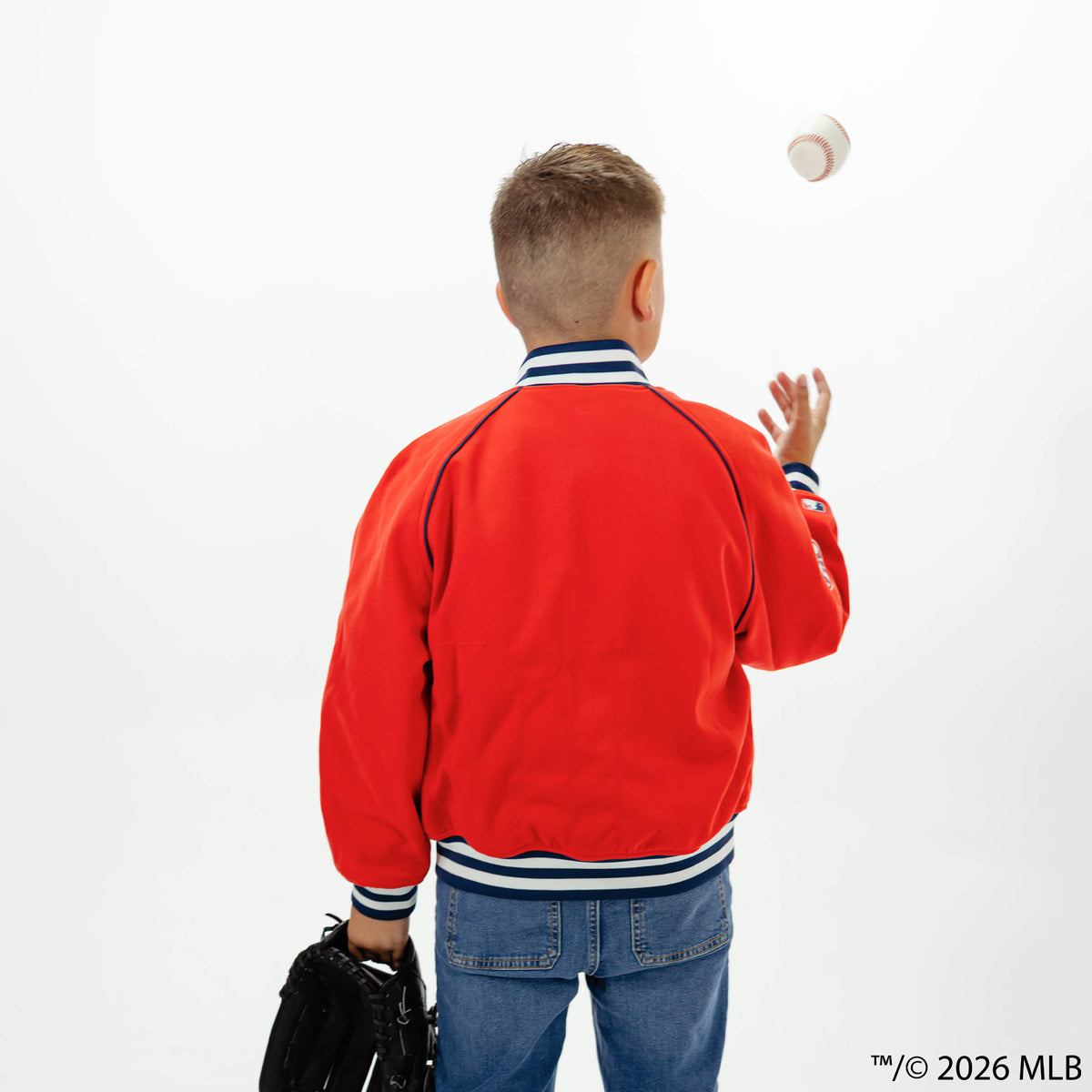 Youth model wearing red Boston Red Sox Stadium youth bomber jacket