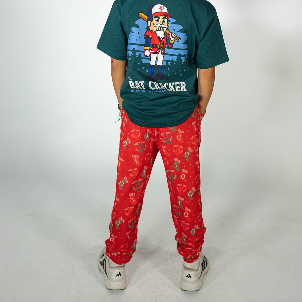 Youth model wearing red Stitched For The SZN youth pajama pants