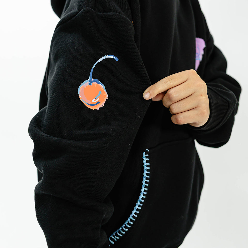 Youth model wearing black youth hoodie with "Fastball Scoops" design