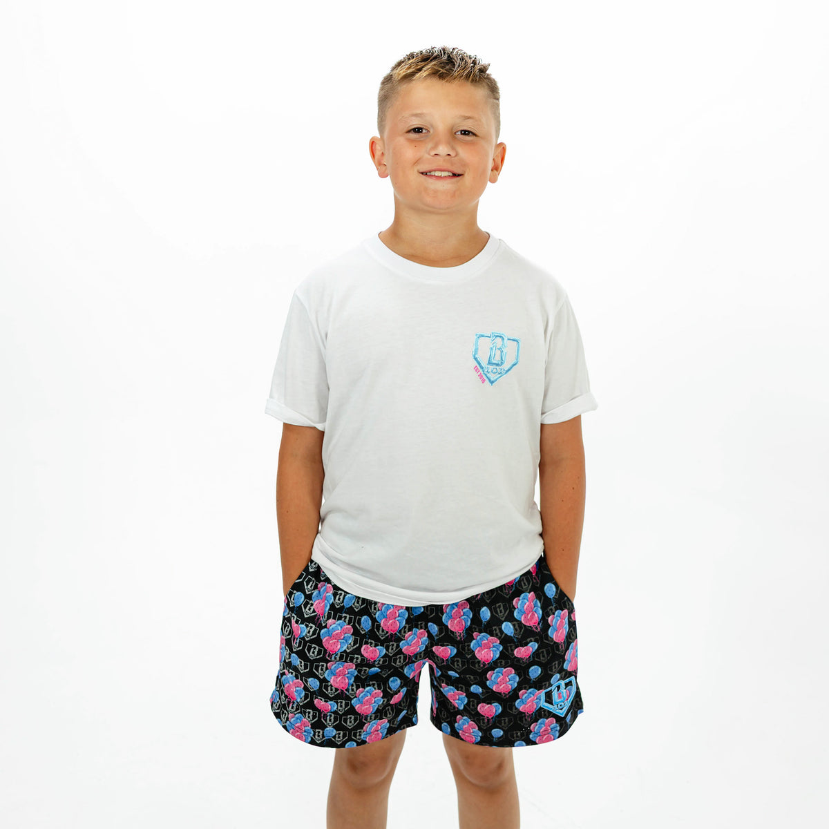 Youth model wearing white youth graphic tee with "10 Year Anniversary" design