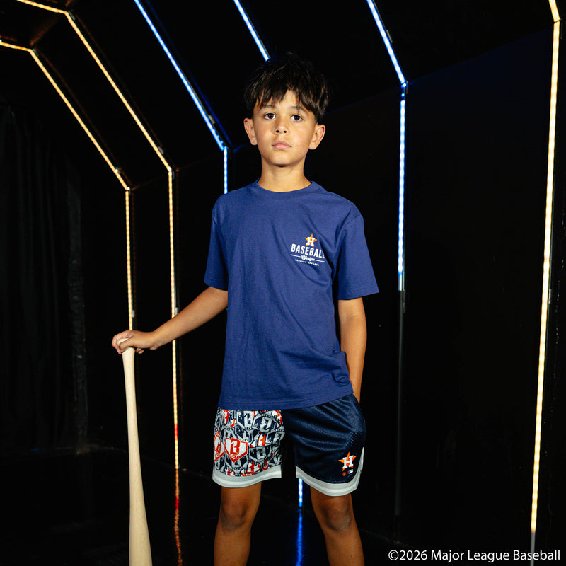 Youth model wearing blue youth shorts with "Houston Astros Sticker Court" design