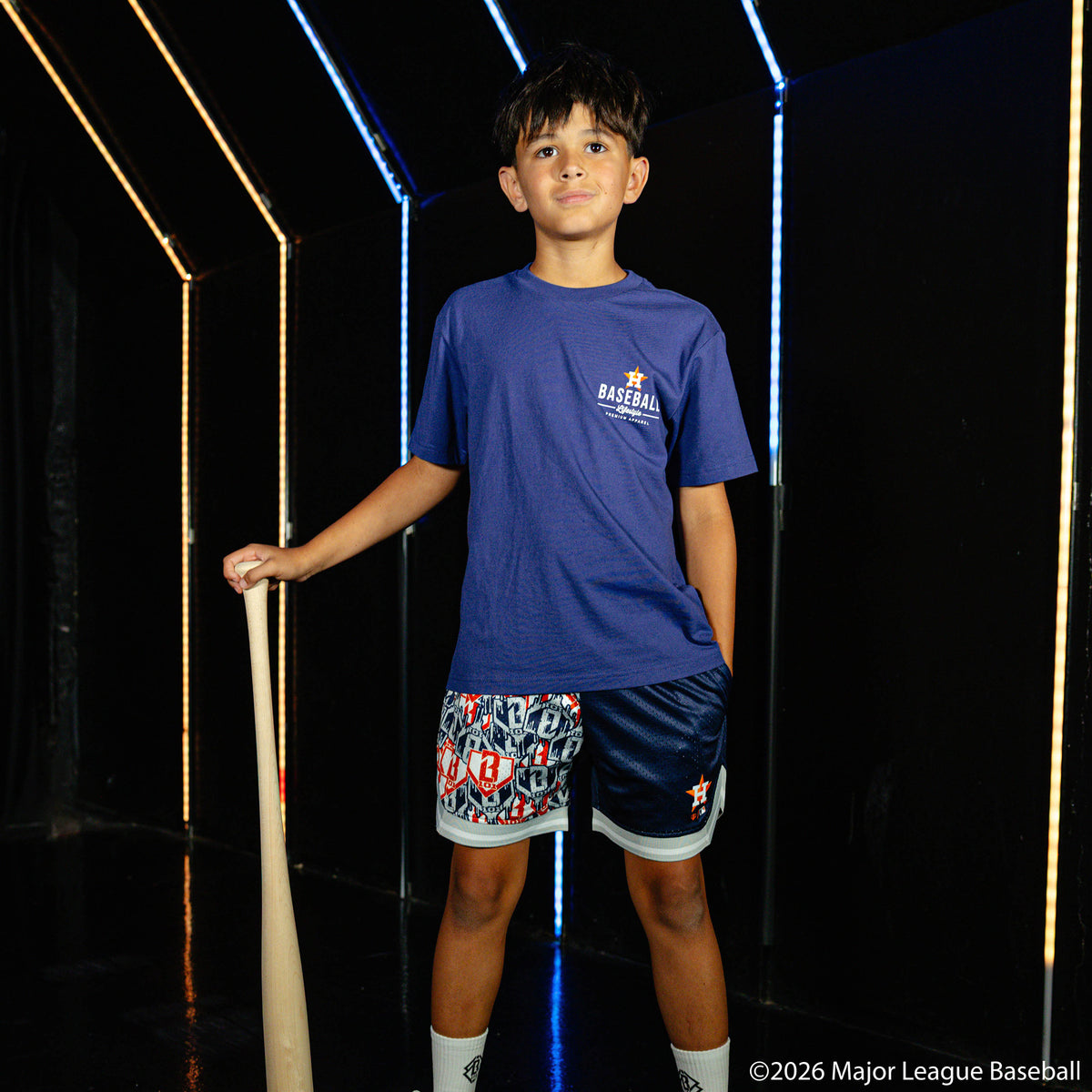 Youth model wearing navy youth graphic tee with "Houston Astros Ice Cream" design