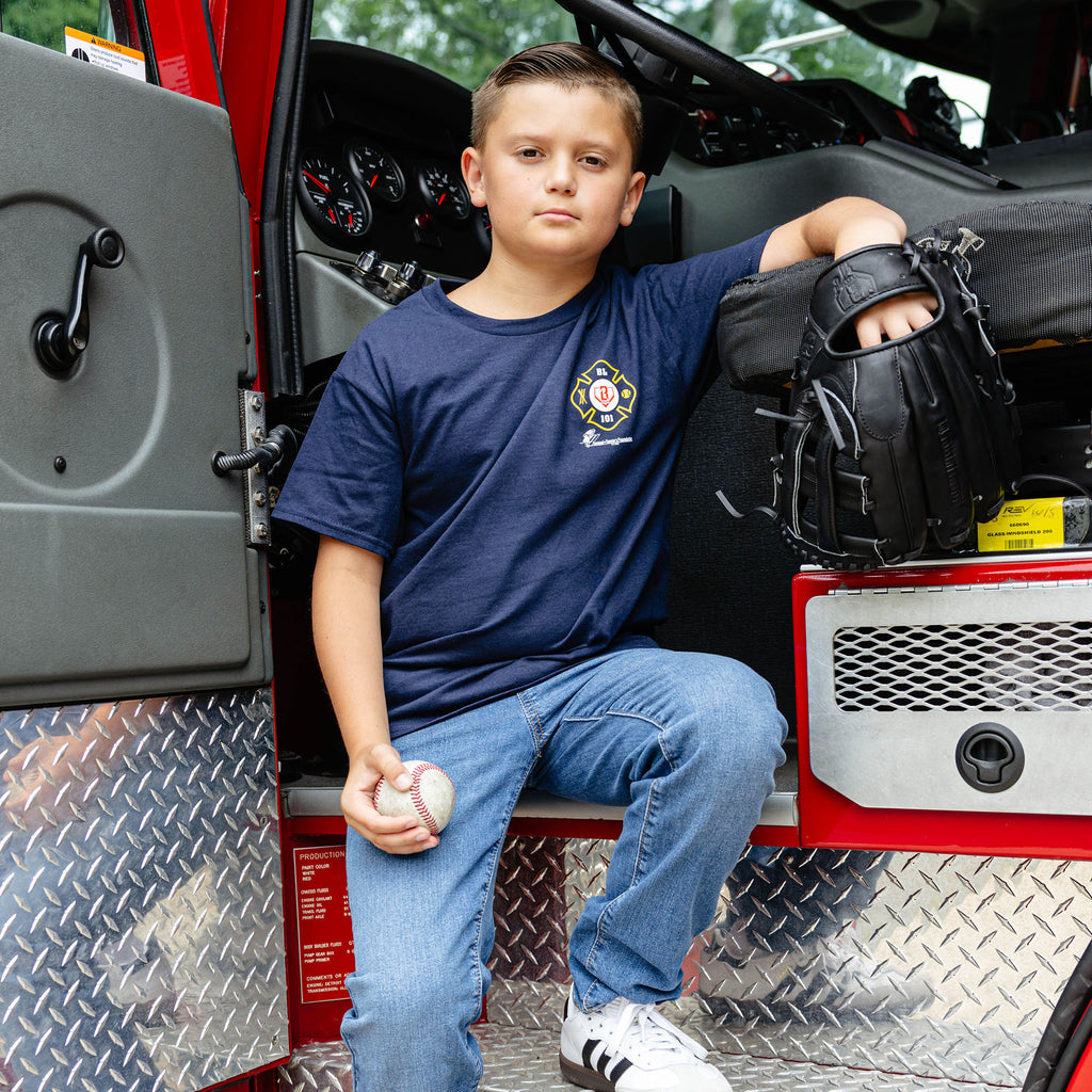 Youth model wearing Navy youth graphic tee with "BL101 X Tunnel to Towers Foundation" design