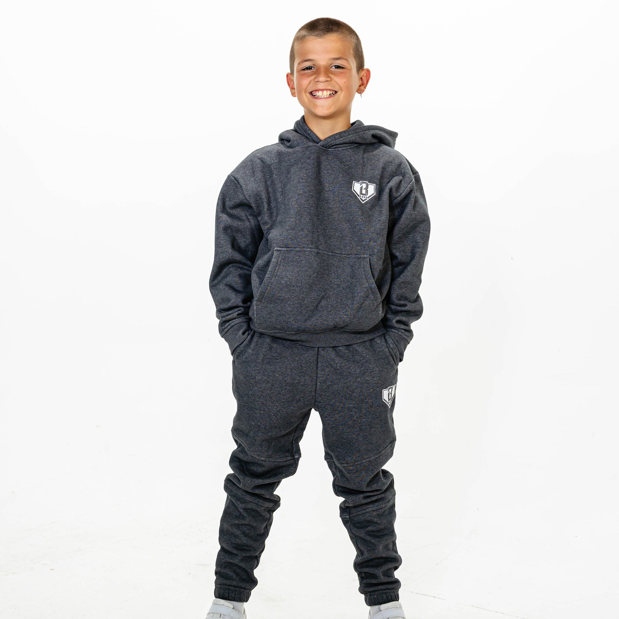 Youth model wearing Gray Baseline hoodie