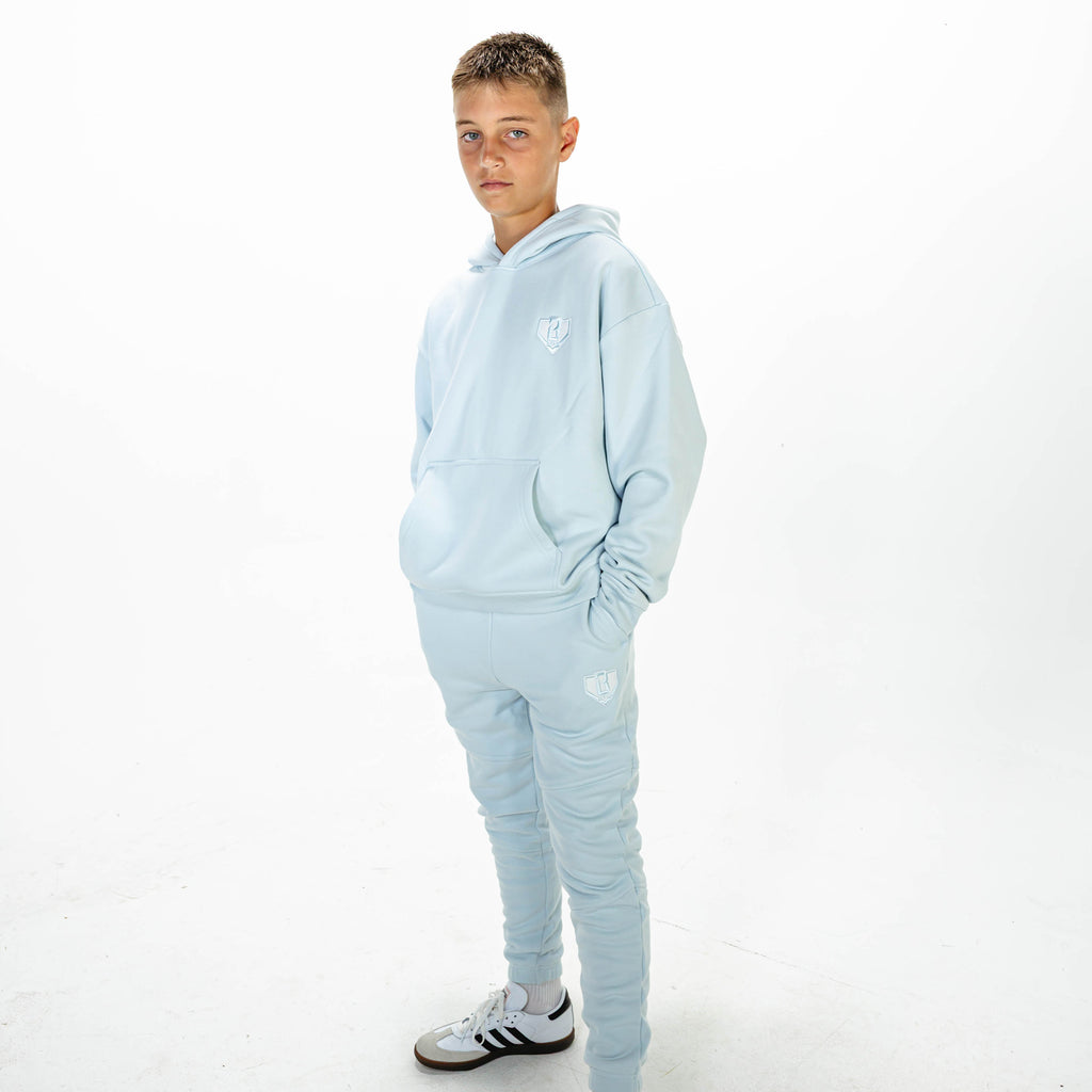 Youth model wearing Blue Baseline joggers