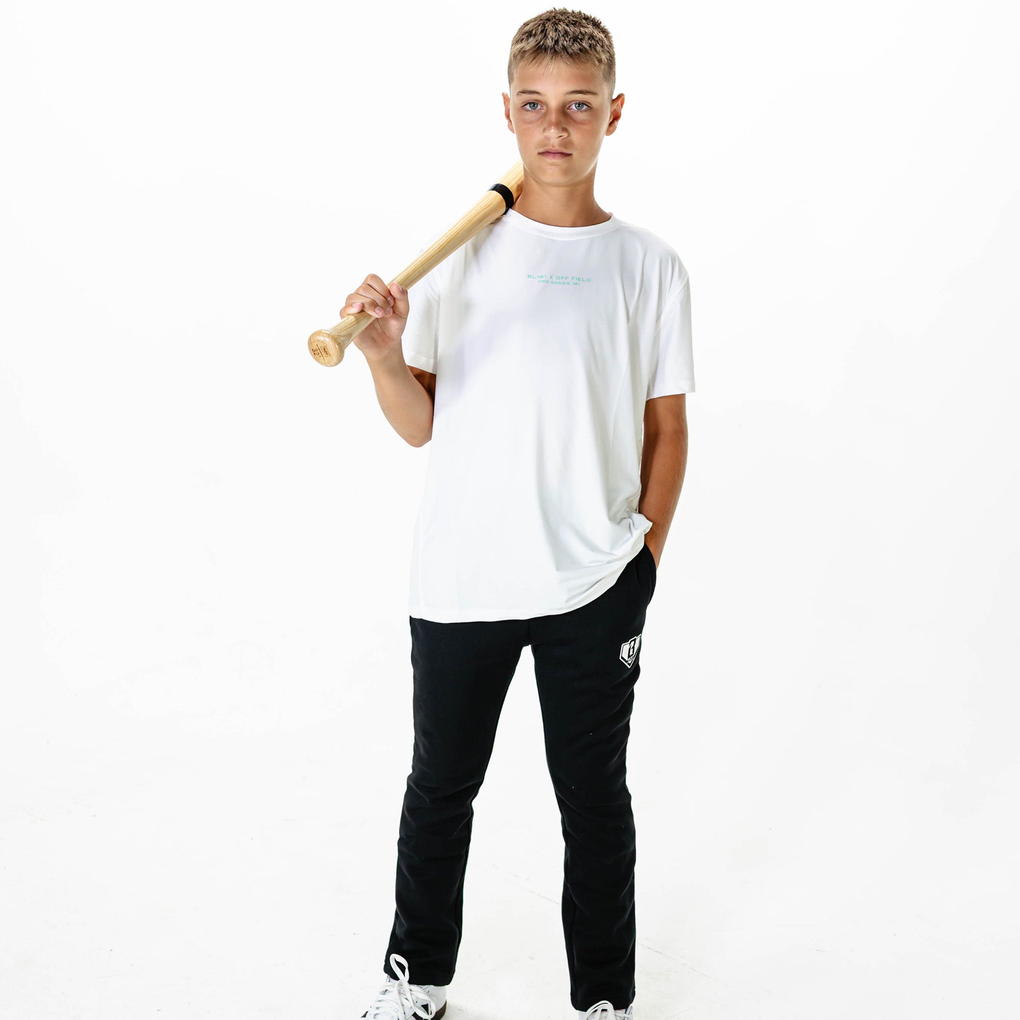 Youth model wearing Black Baseline Straight Leg sweatpants