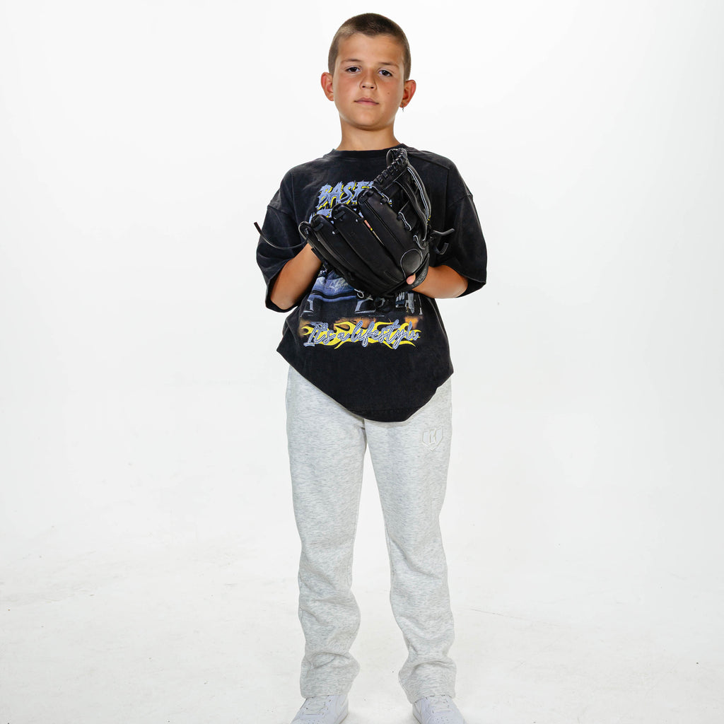 Youth model wearing Gray Baseline Straight Leg sweatpants