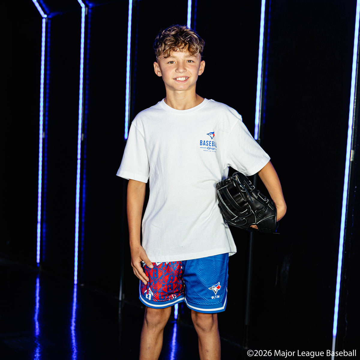 Youth model wearing white youth graphic tee with "Toronto Blue Jays Ice Cream" design