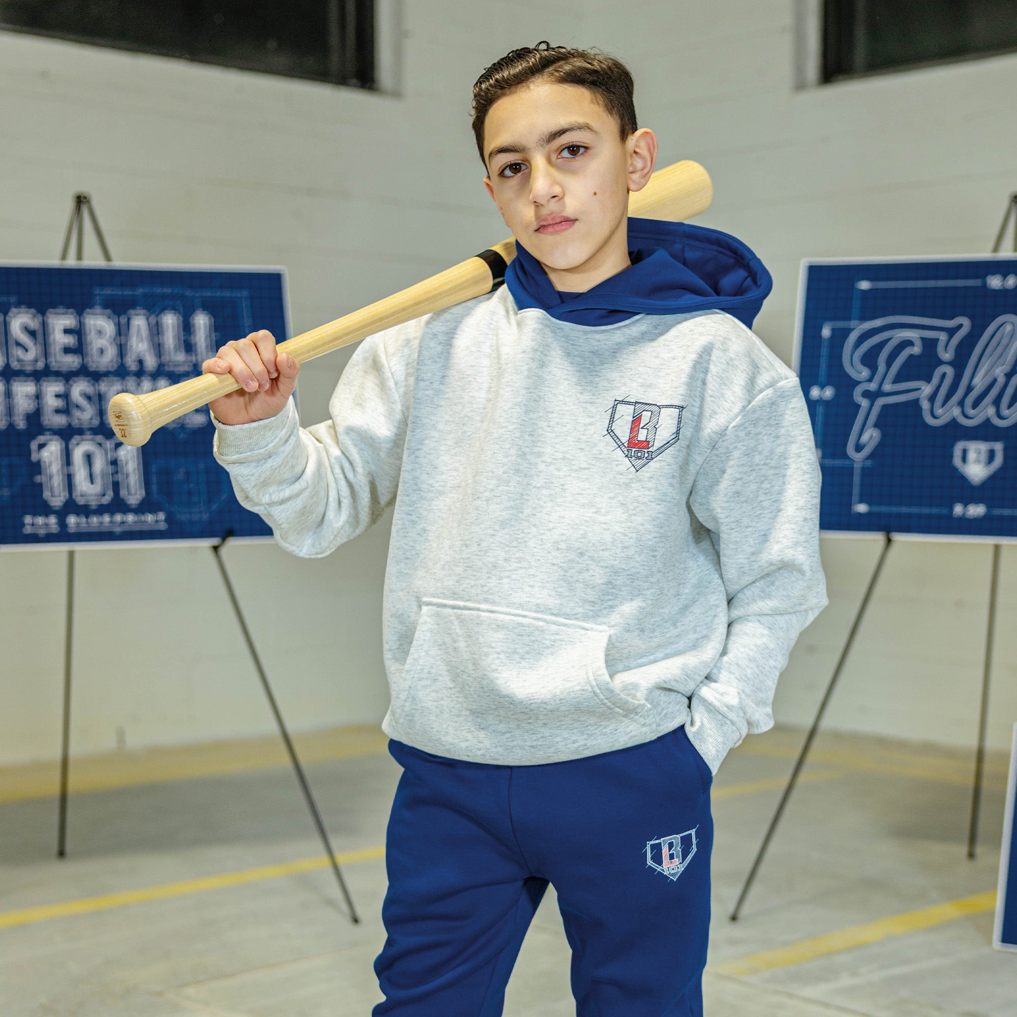 Youth model wearing gray Blueprint BL Heather Gray youth hoodie