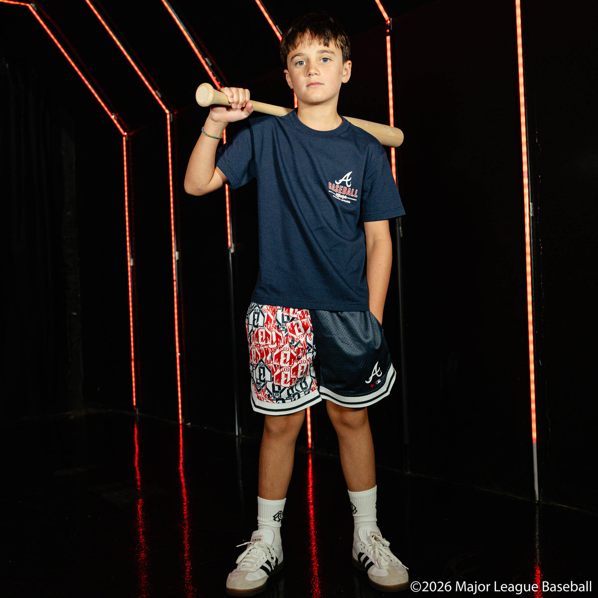 Youth model wearing navy youth graphic tee with "Atlanta Braves Ice Cream" design