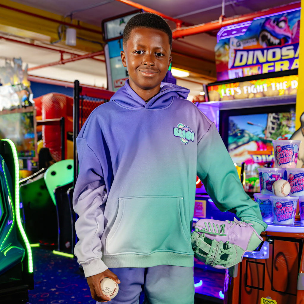 Youth model wearing Cotton Candy Galaxy Grape youth hoodie