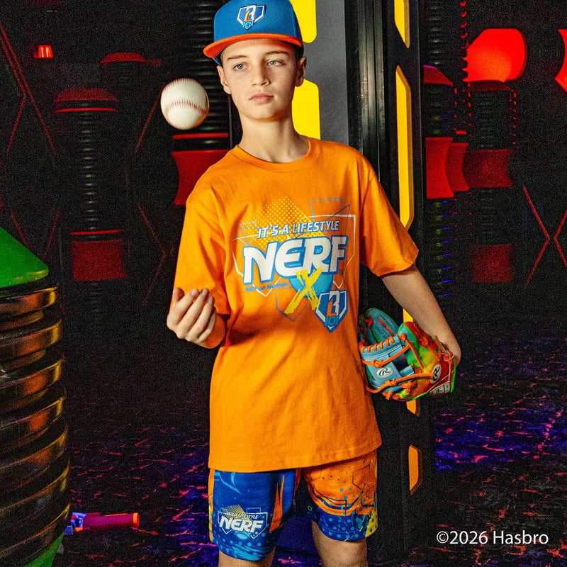 Person wearing an orange 'BL101 X NERF' shirt and blue shorts in a colorful, action-packed setting.