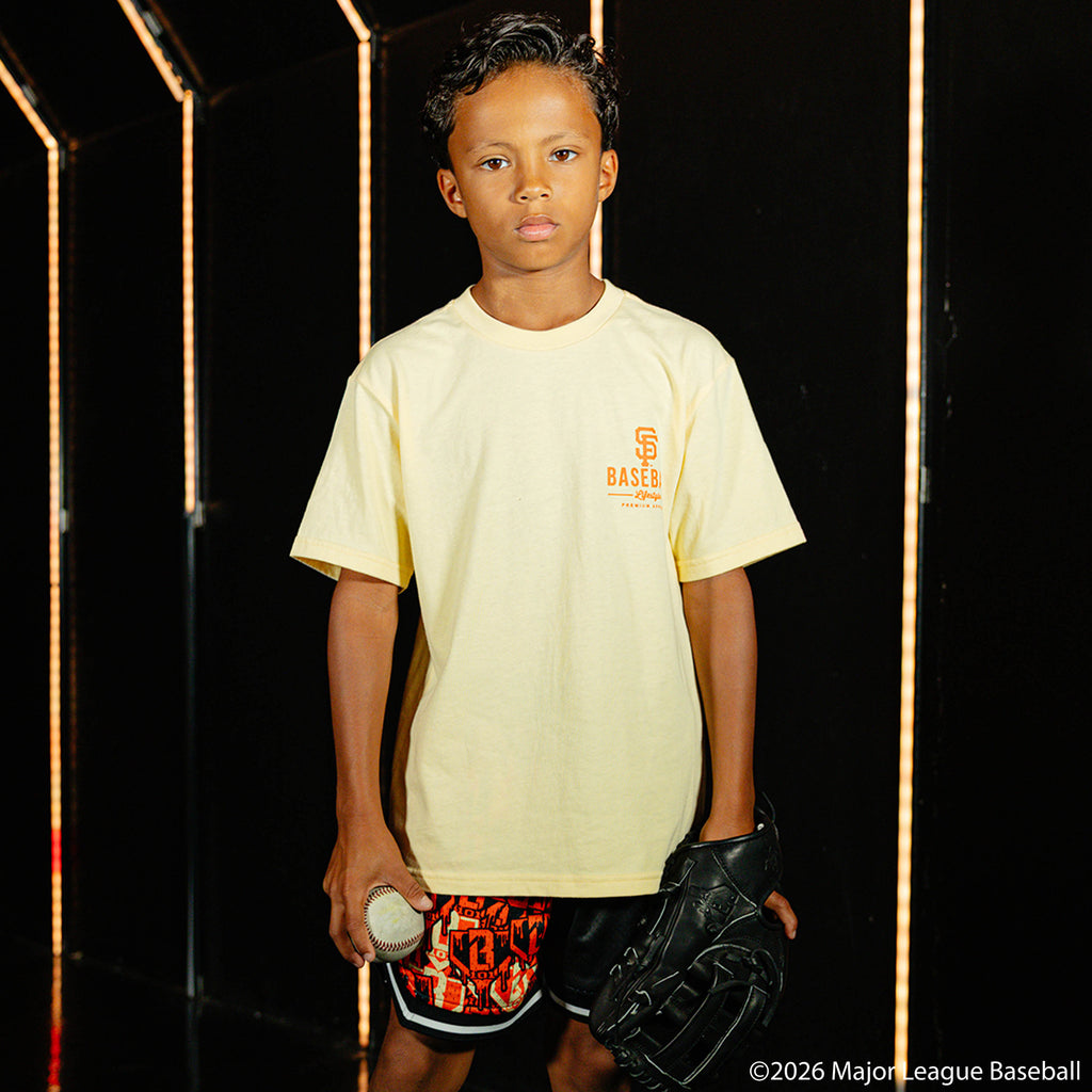 Youth model wearing cream youth graphic tee with "San Francisco Giants Ice Cream" design