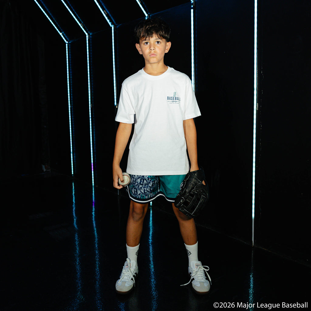 Youth model wearing white youth graphic tee with "Seattle Mariners Ice Cream Cap" design