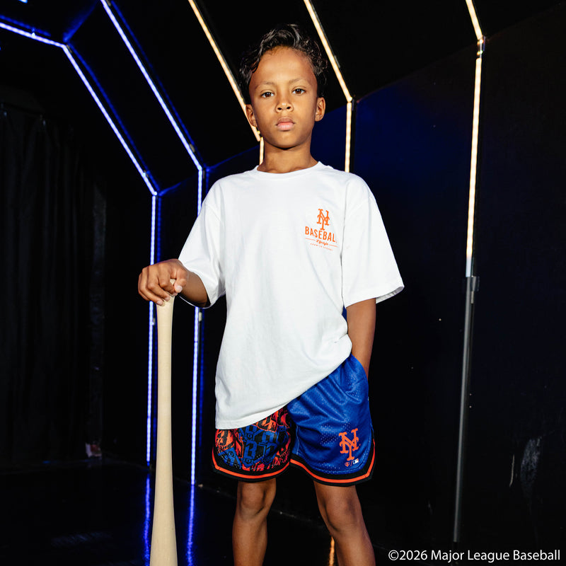 Youth model wearing blue youth shorts with "New York Mets Sticker Court" design