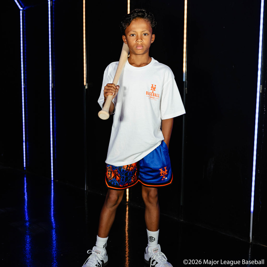 Youth model wearing white youth graphic tee with "New York Mets Ice Cream Cap" design