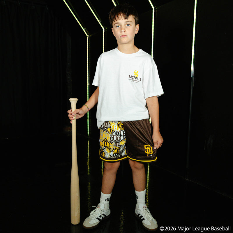 Youth model wearing youth shorts with "San Diego Padres Sticker Court" design
