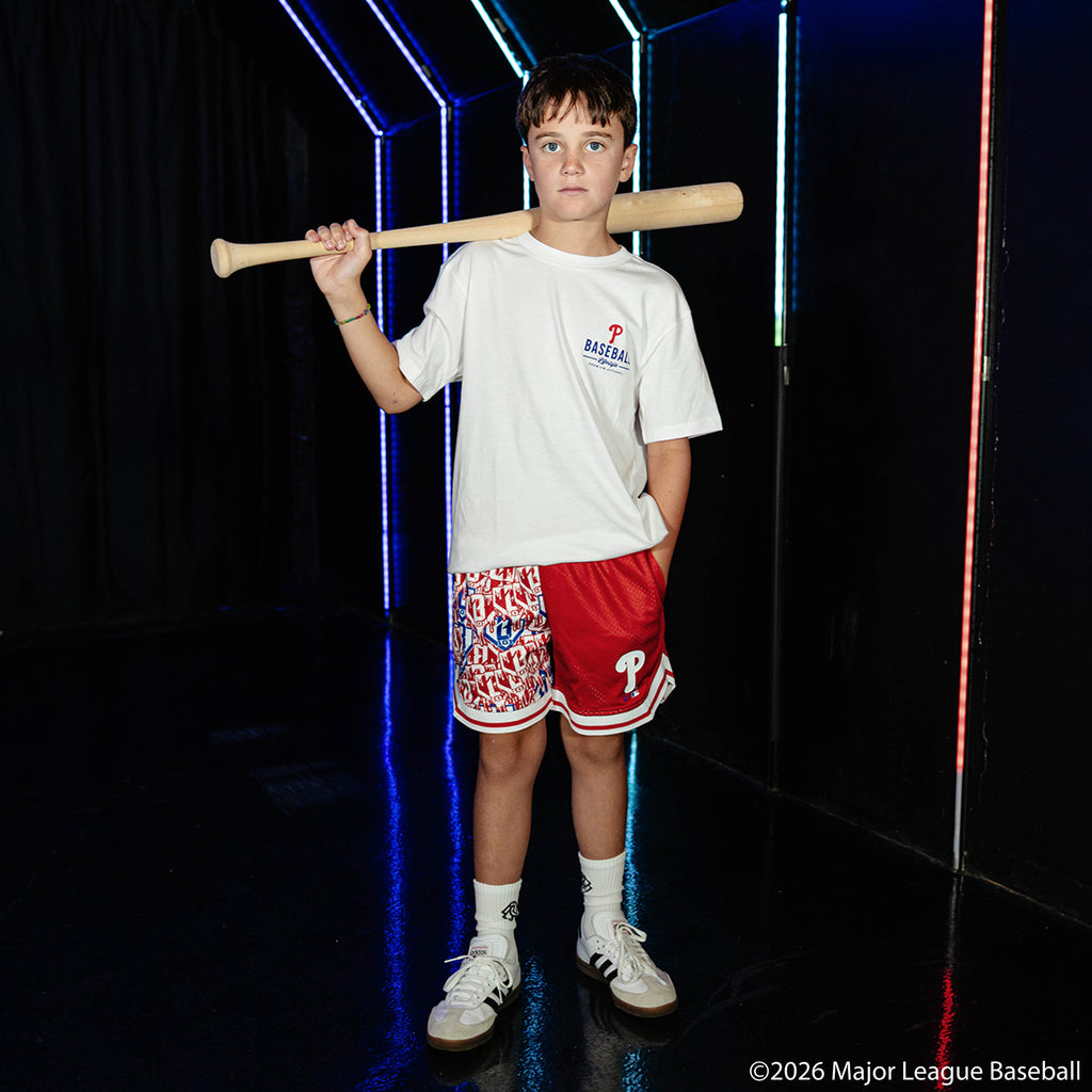 Youth model wearing white youth graphic tee with "Philadelphia Phillies Ice Cream Cap" design