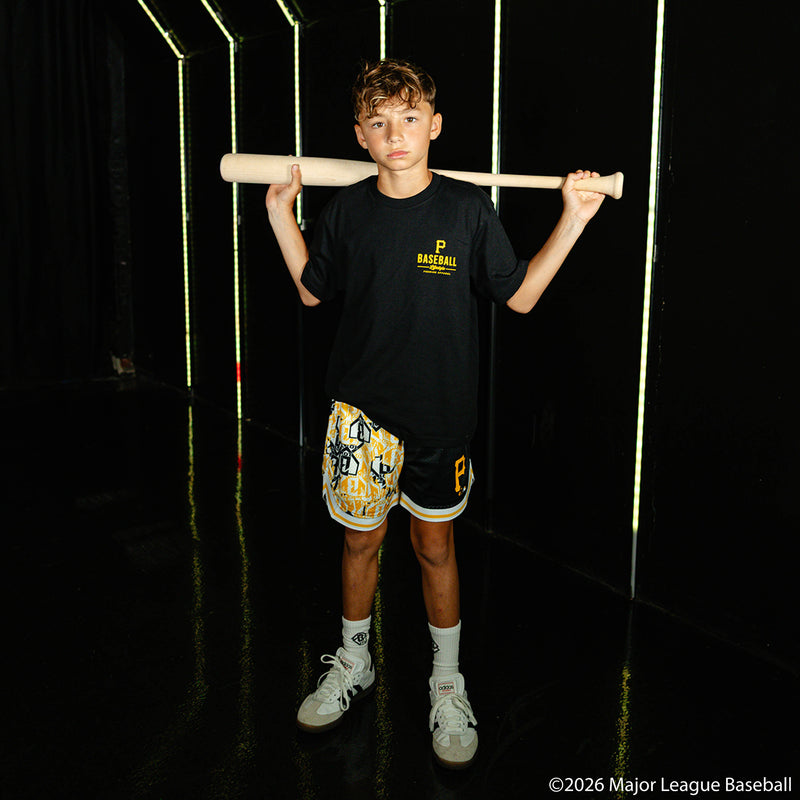 Youth model wearing black youth shorts with "Pittsburgh Pirates Sticker Court" design