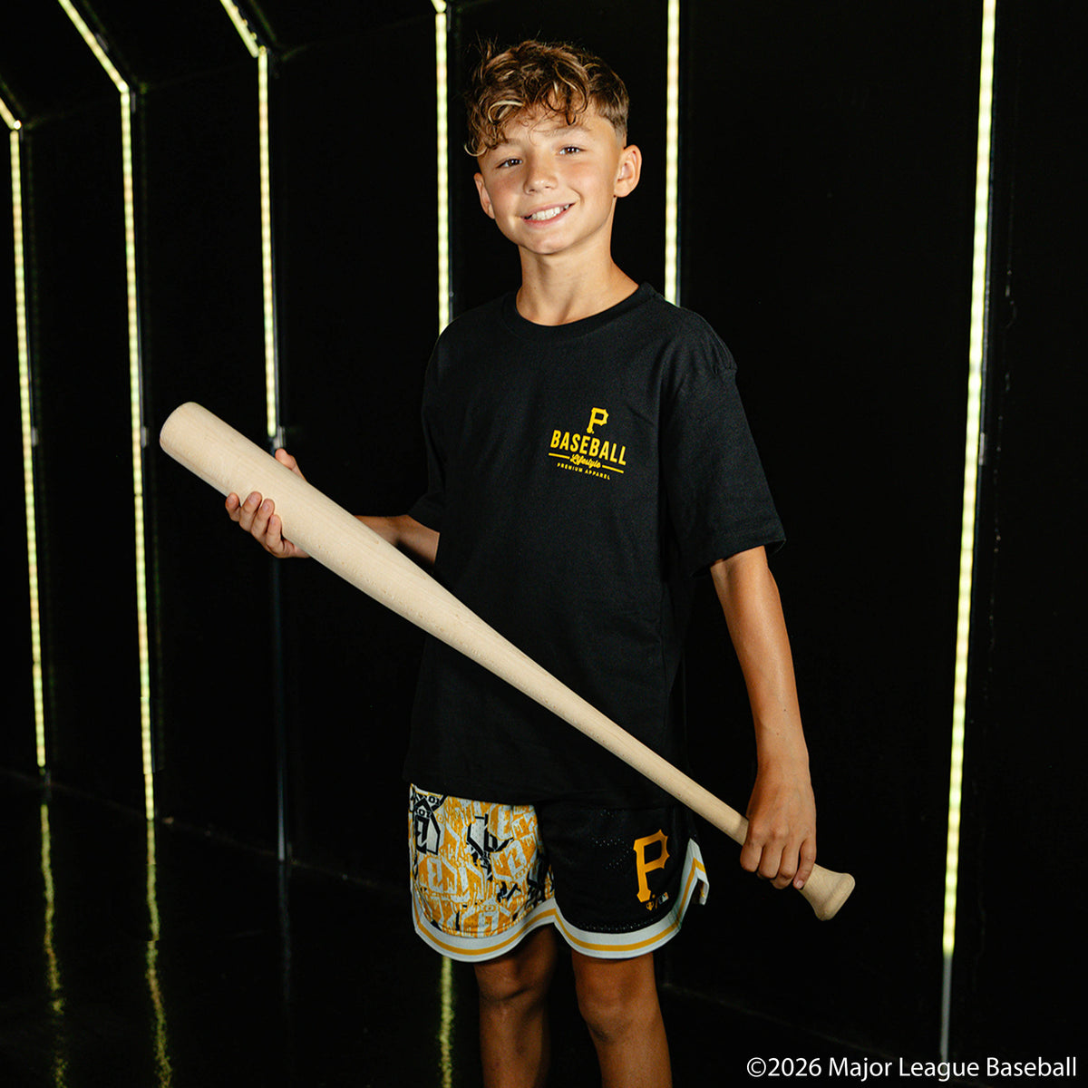 Youth model wearing black youth graphic tee with "Pittsburgh Pirates Ice Cream Cap" design