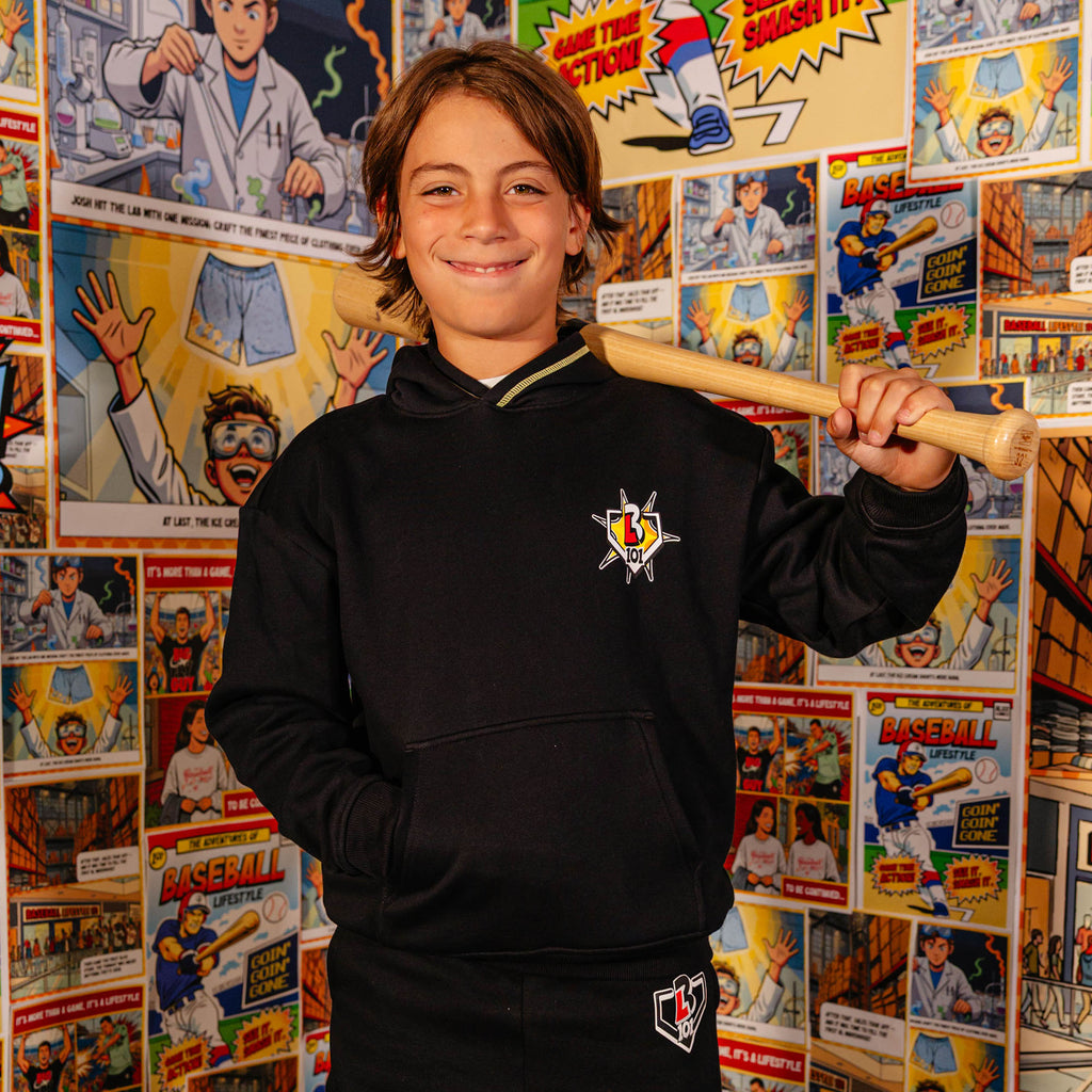 Youth model wearing black youth hoodie with "Power Hitter" design