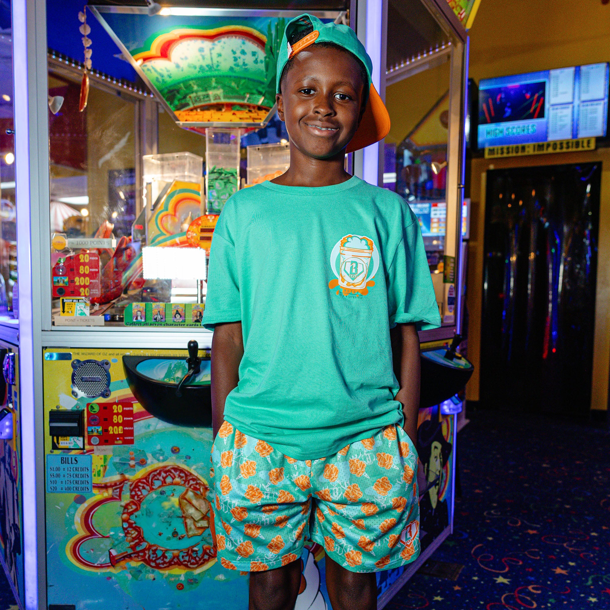 Youth model wearing Sweet Spot Tangerine Freeze youth graphic tee