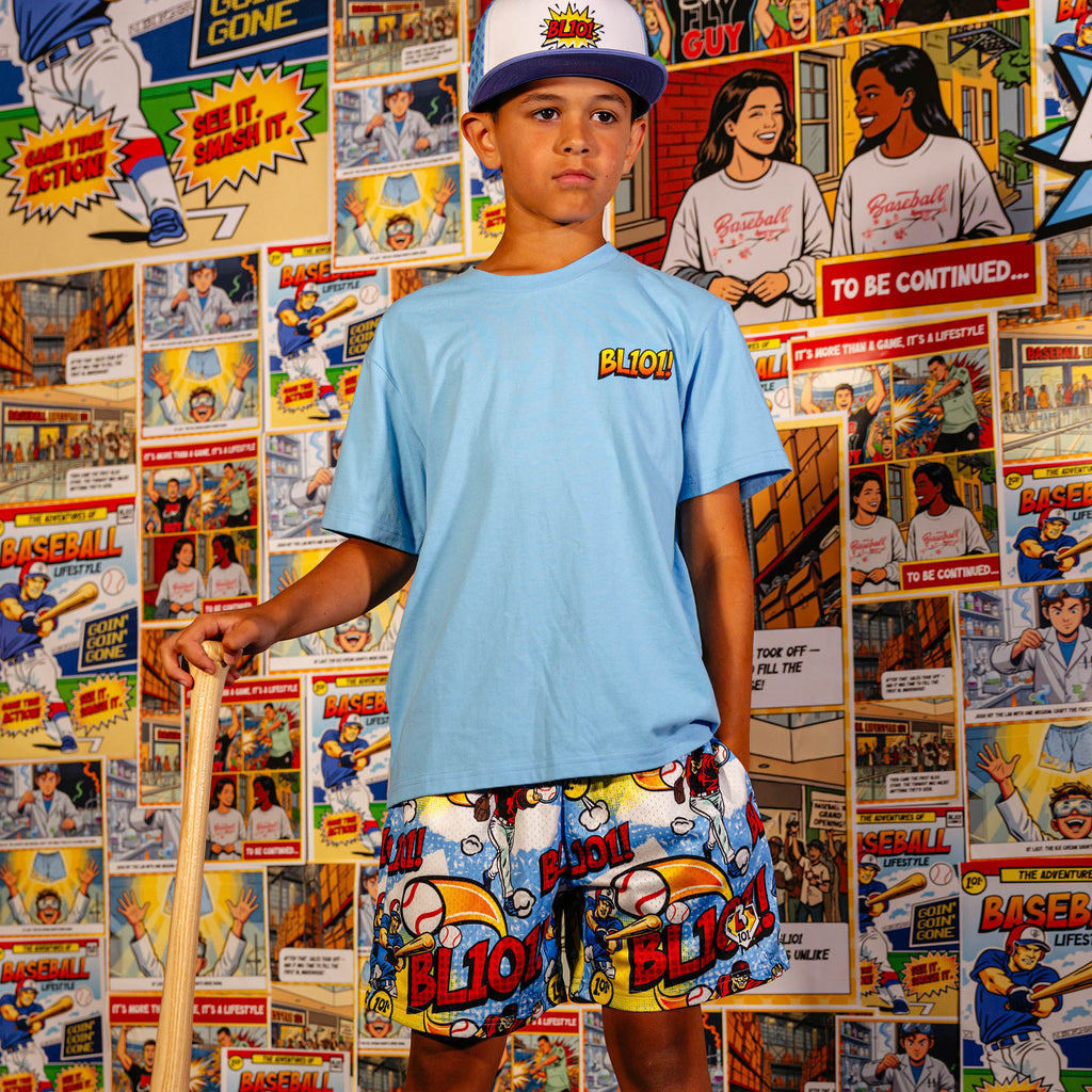 Youth model wearing Swing For The Fences youth shorts