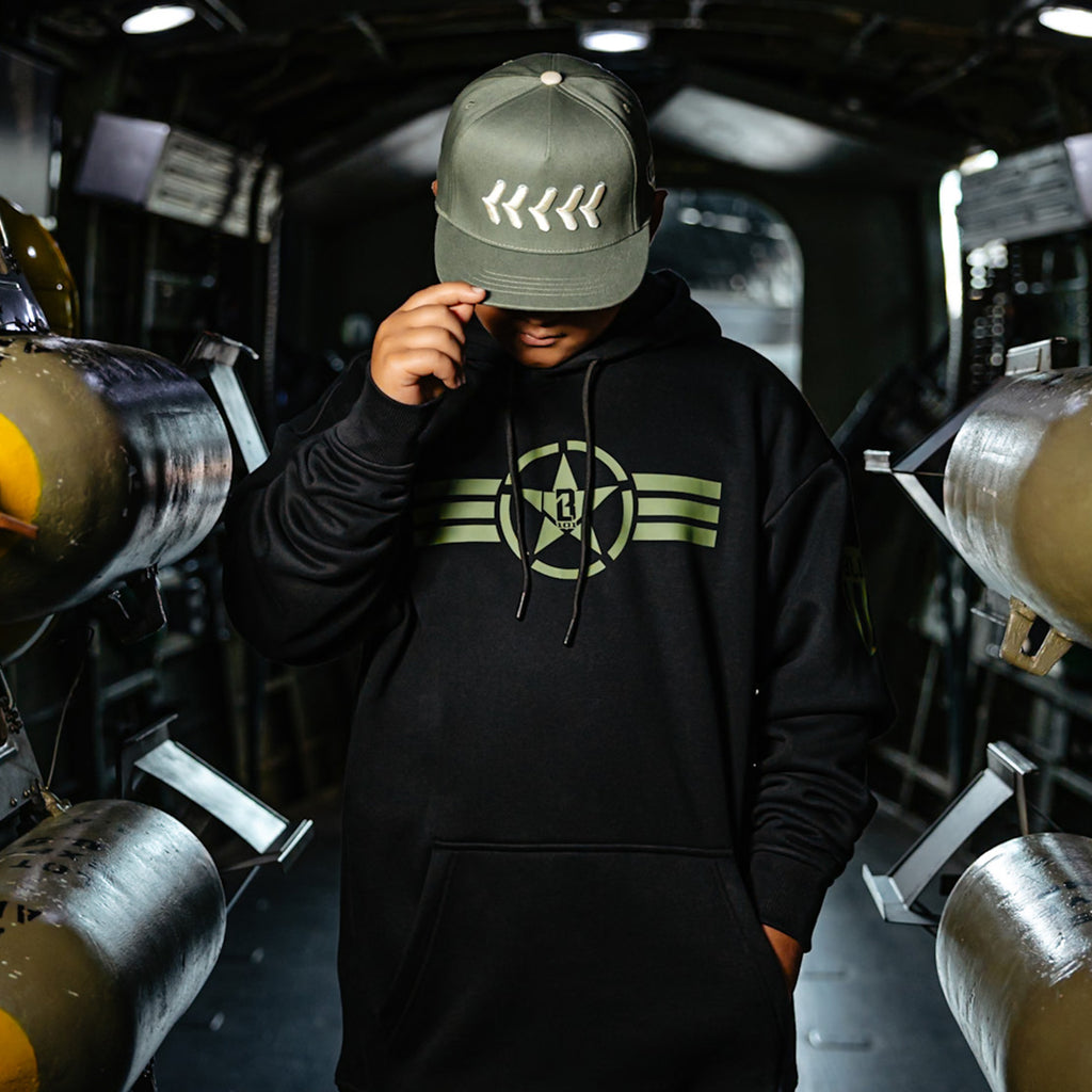 Youth model wearing black Field General BL Black youth hoodie